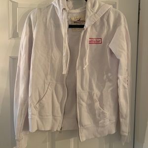 White zip up hoodie.